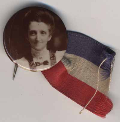 sepia tone portrait of a woman with red white and blue ribbon attached