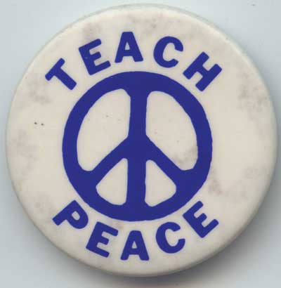 Teach Peace blue sign on wh
